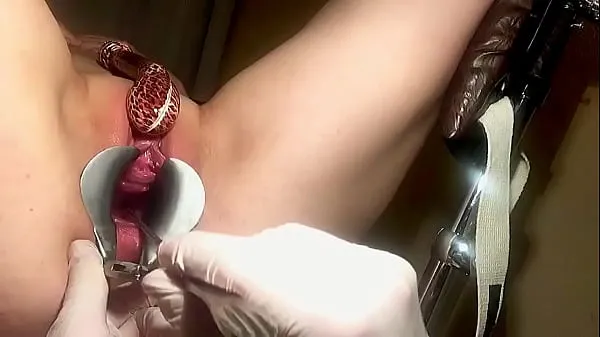 Mira cuello uterino reventado durante el examen ginecológico rizado clips cálidos